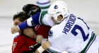 Canucks rally to beat Flames in shootout